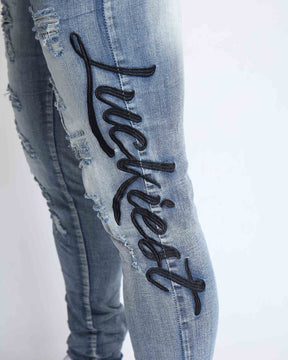 Light Wash Blue Ripped Jeans with Big Letters Embroidered