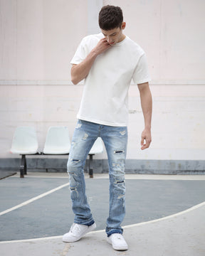 Light Wash Blue Ripped Jeans with Irregular Ripped