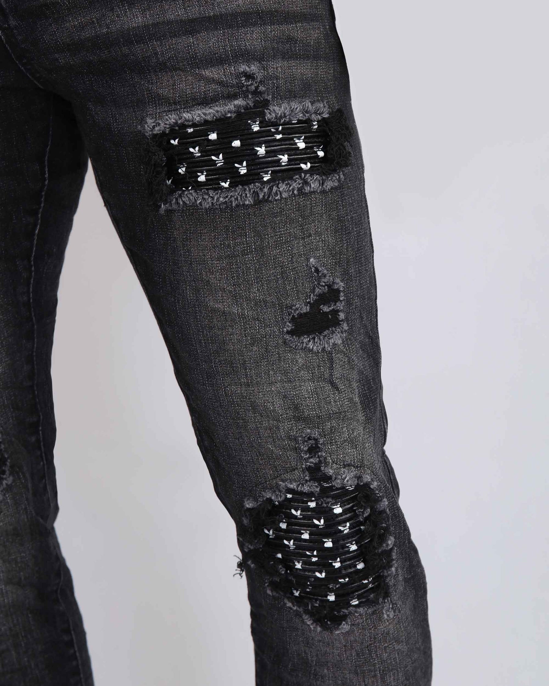 Black Ripped Jeans with Striking Black Patches