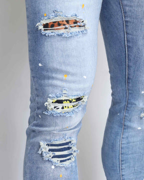 Wild Elegance Blue Ripped Jeans with Delicate Tiger Embroidery