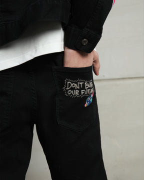 Vaqueros rasgados con patchwork de streetwear negros