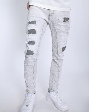 Slim Fit Gray Jeans with Rips, Patches, and Distressed Detailing