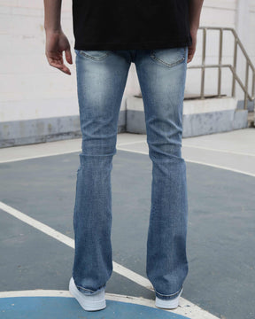 Light Wash Blue Jeans with Ripped Text