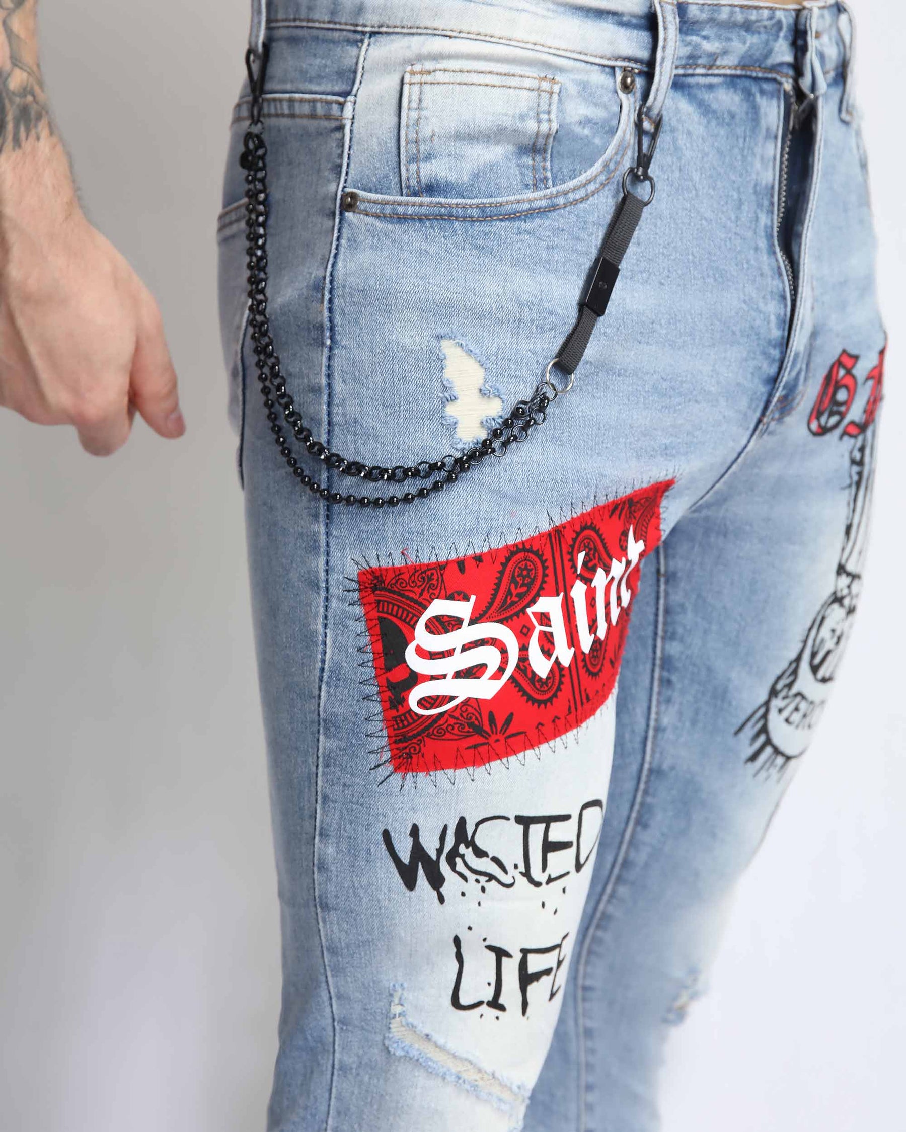 Graffiti Ripped Blue Jeans with Red Patches and Cashew Flower Elements