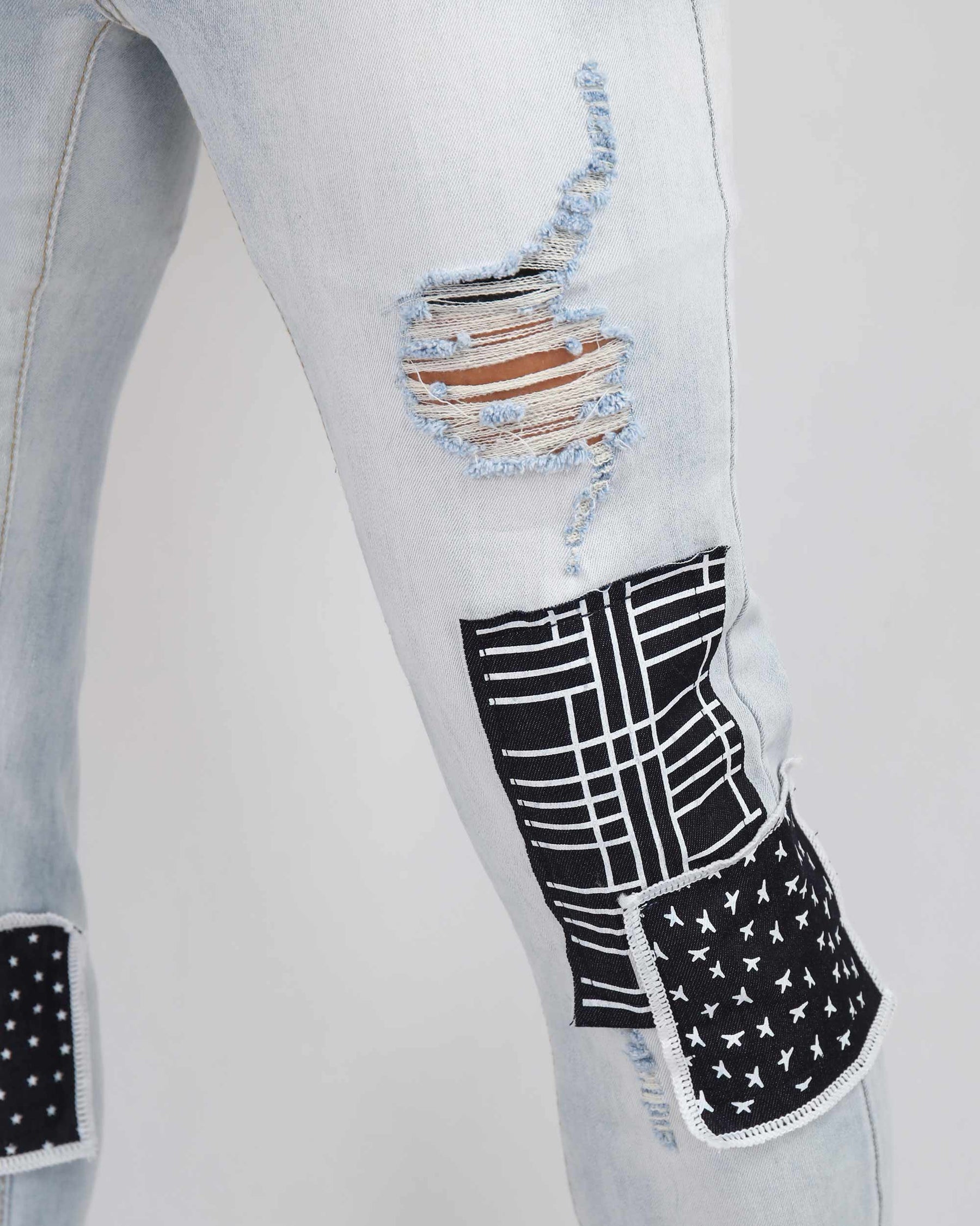 Blue Ripped Jeans with Striking Black Patches
