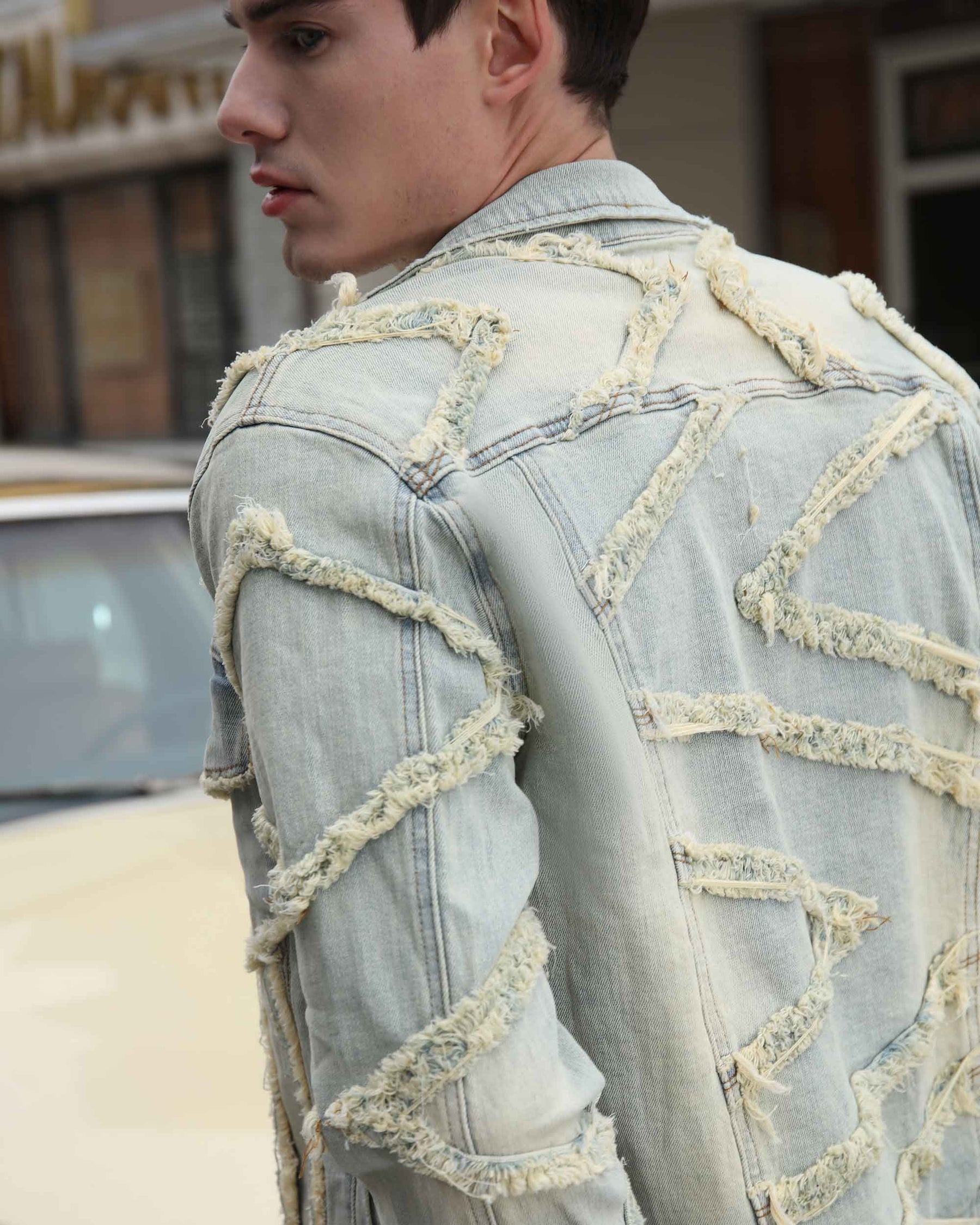 Vintage Blue Denim Jacket with Ripped Stitching