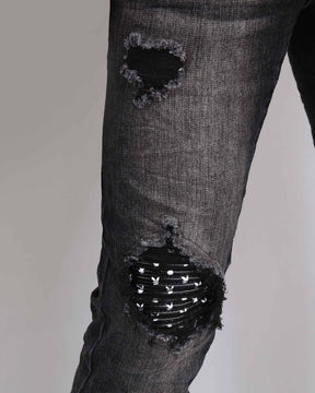 Black Ripped Jeans with Striking Black Patches