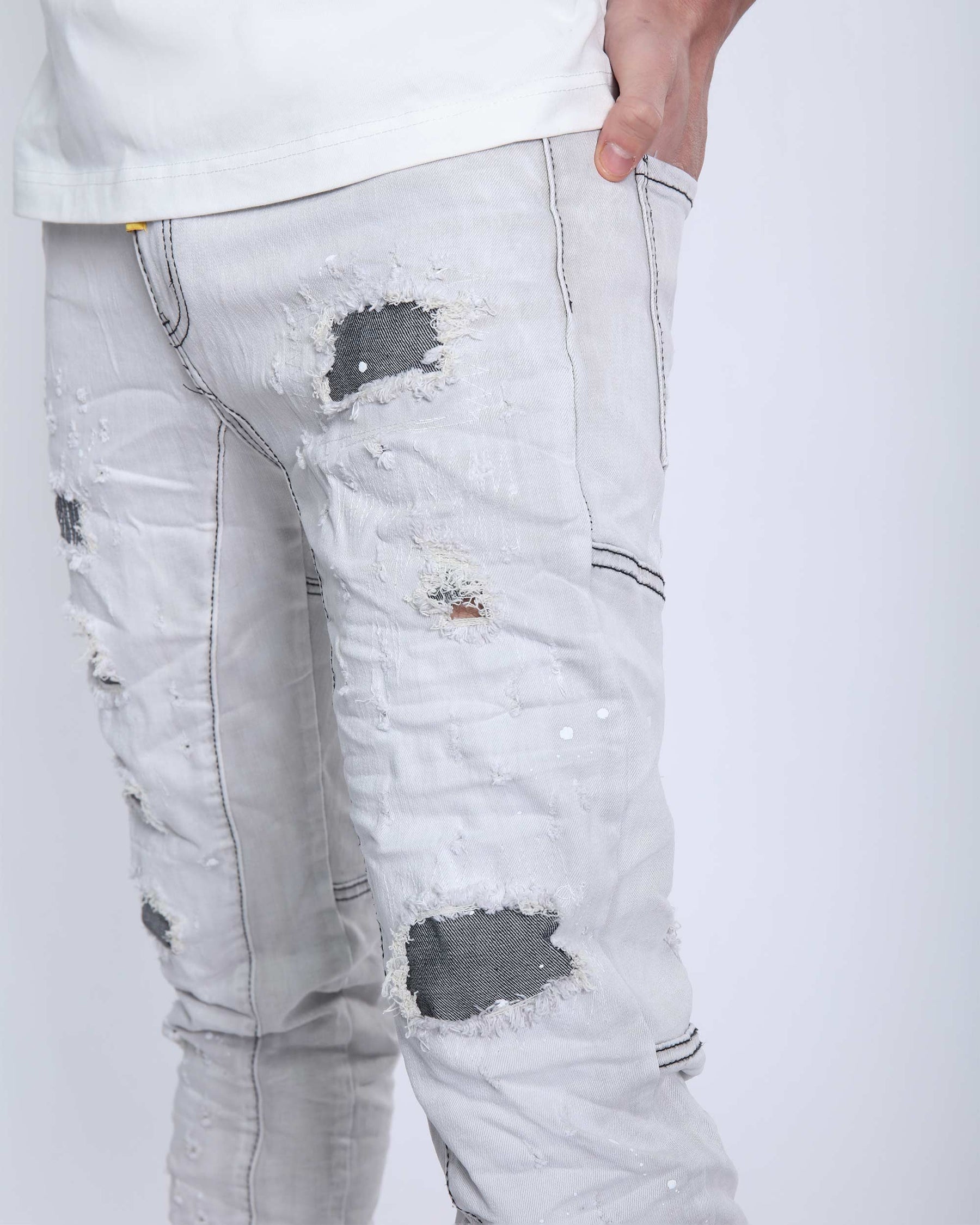 Slim Fit Gray Jeans with Rips, Patches, and Distressed Detailing