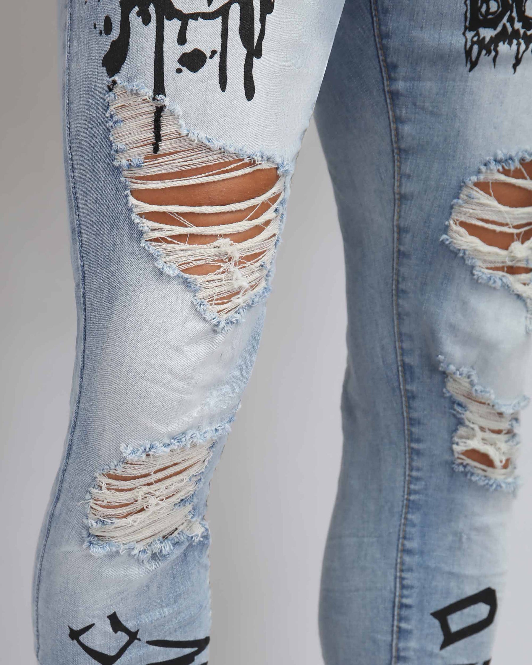 Large Ripped Blue Jeans with Skull Design