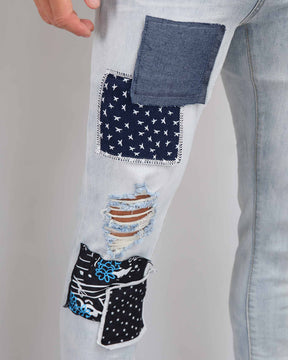 Blue Ripped Jeans with Striking Black Patches