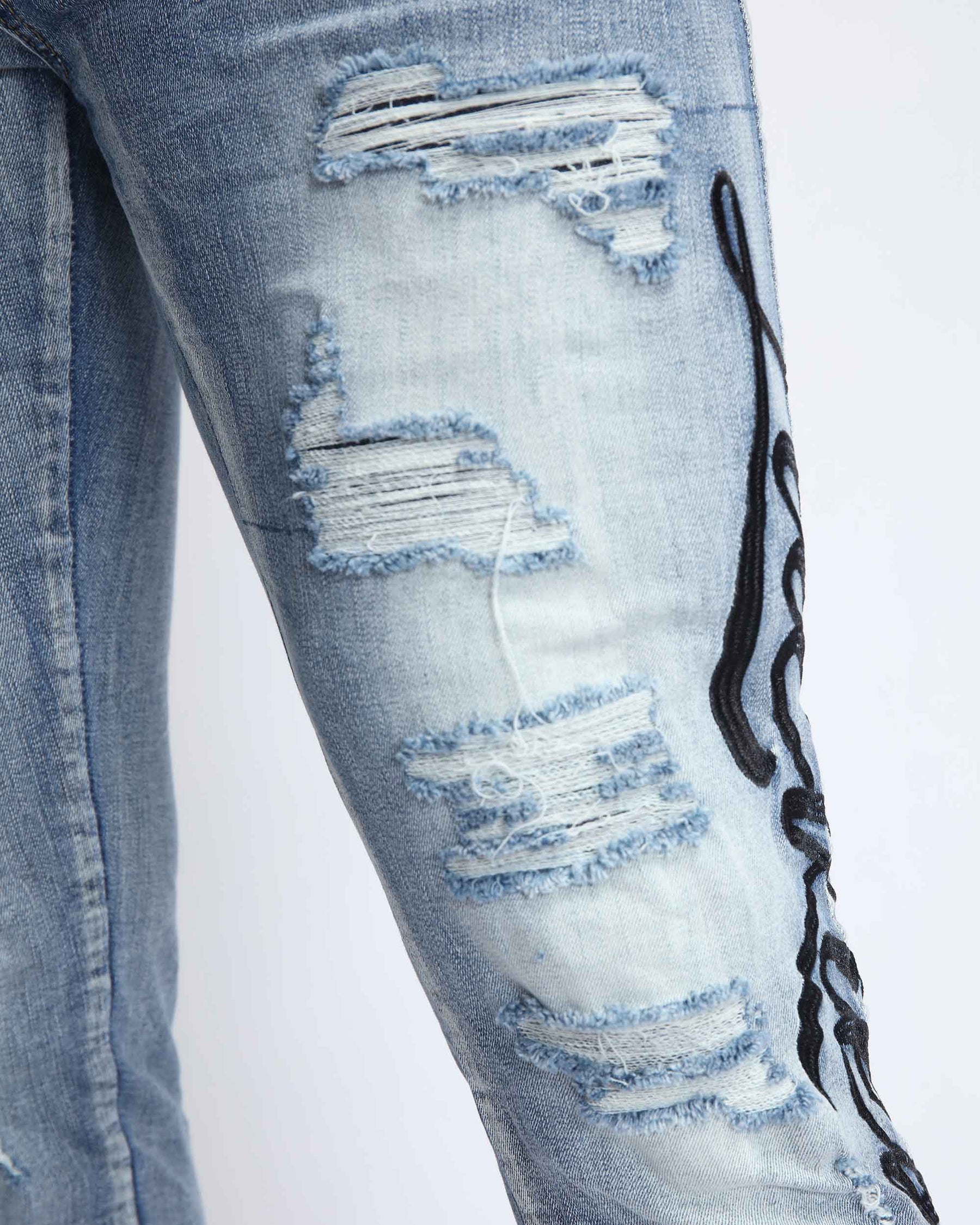 Light Wash Blue Ripped Jeans with Big Letters Embroidered