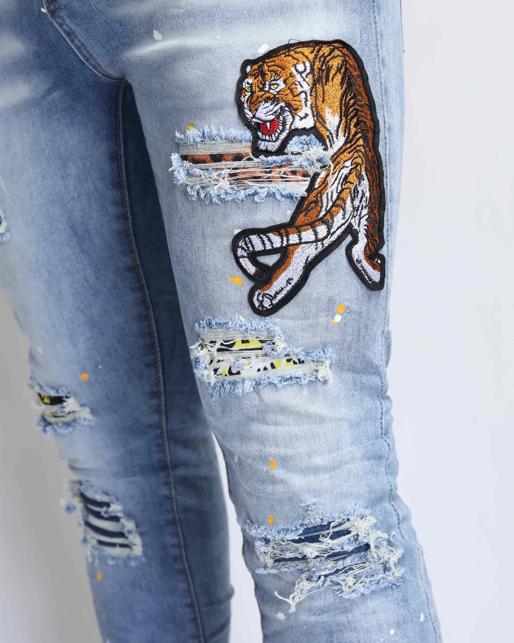 Wild Elegance Blue Ripped Jeans with Delicate Tiger Embroidery