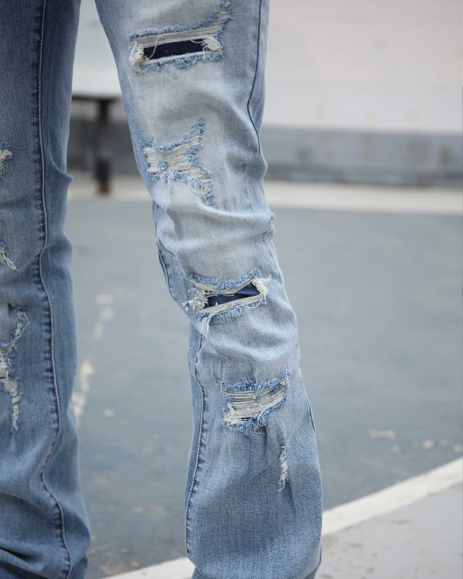 Light Wash Blue Ripped Jeans with Irregular Ripped