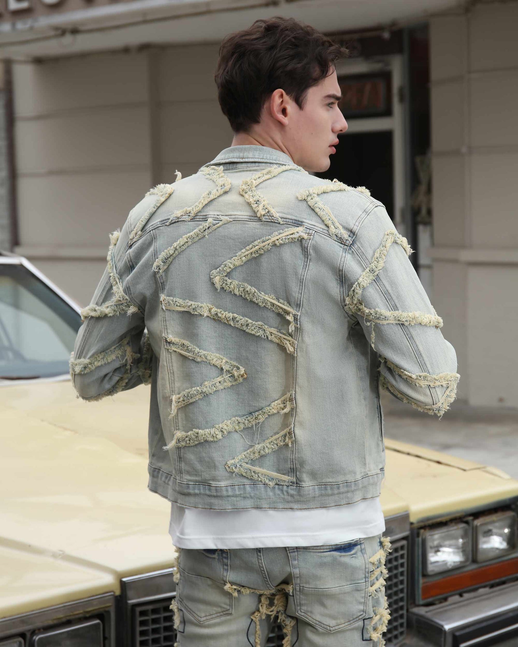 Vintage Blue Denim Jacket with Ripped Stitching