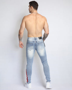 Graffiti Ripped Blue Jeans with Red Patches and Cashew Flower Elements