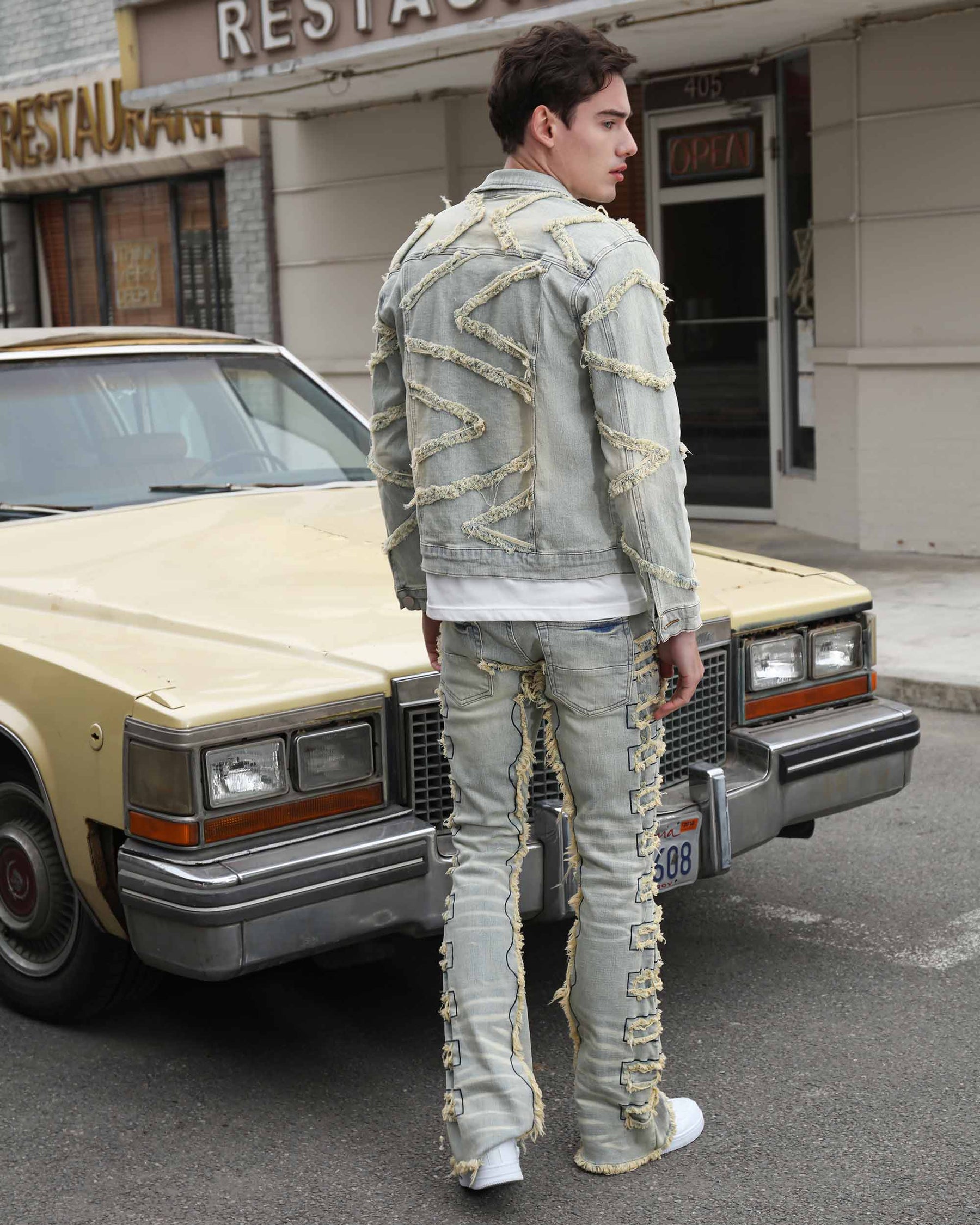 Vintage Blue Denim Jacket with Ripped Stitching