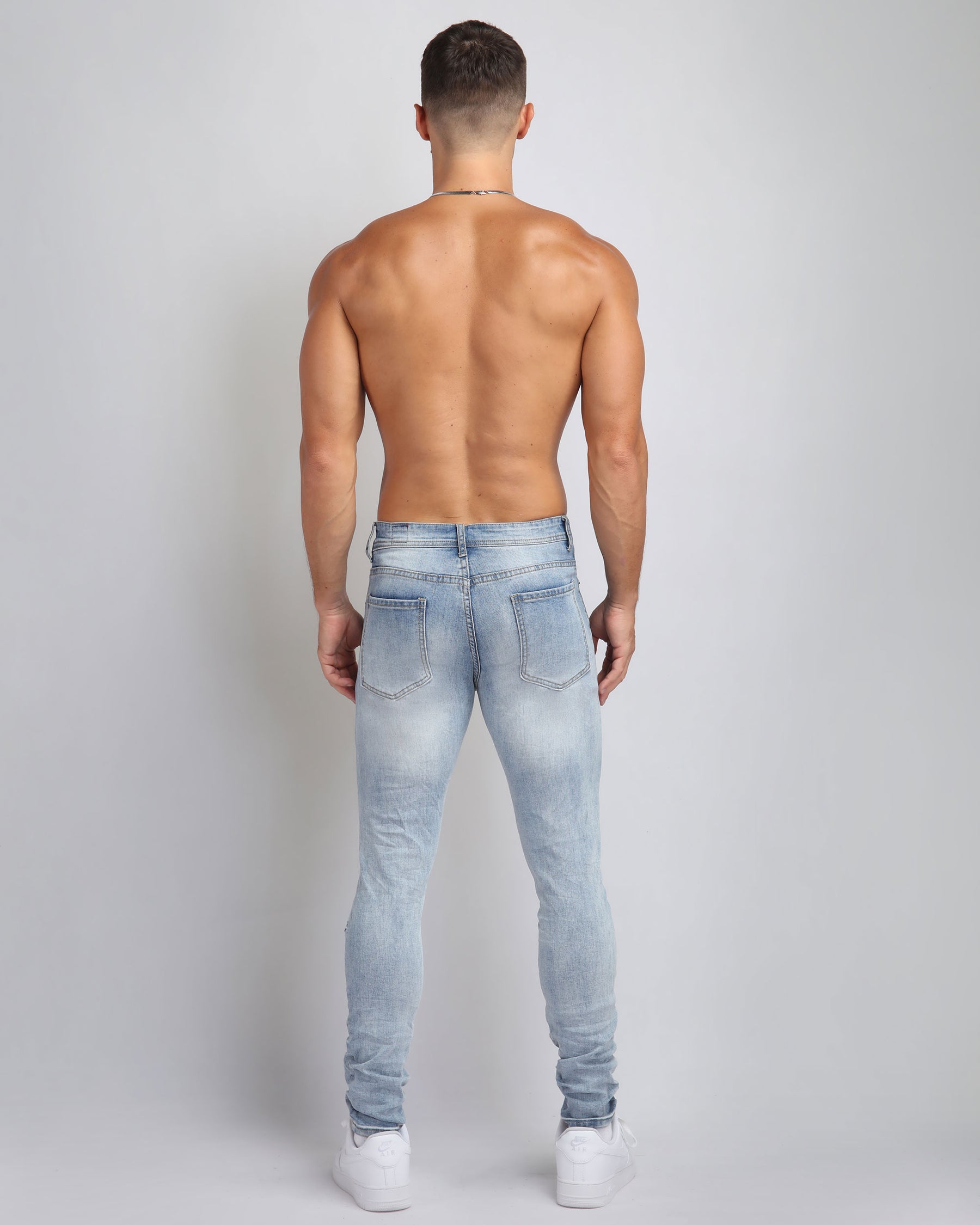 Large Ripped Blue Jeans with Skull Design