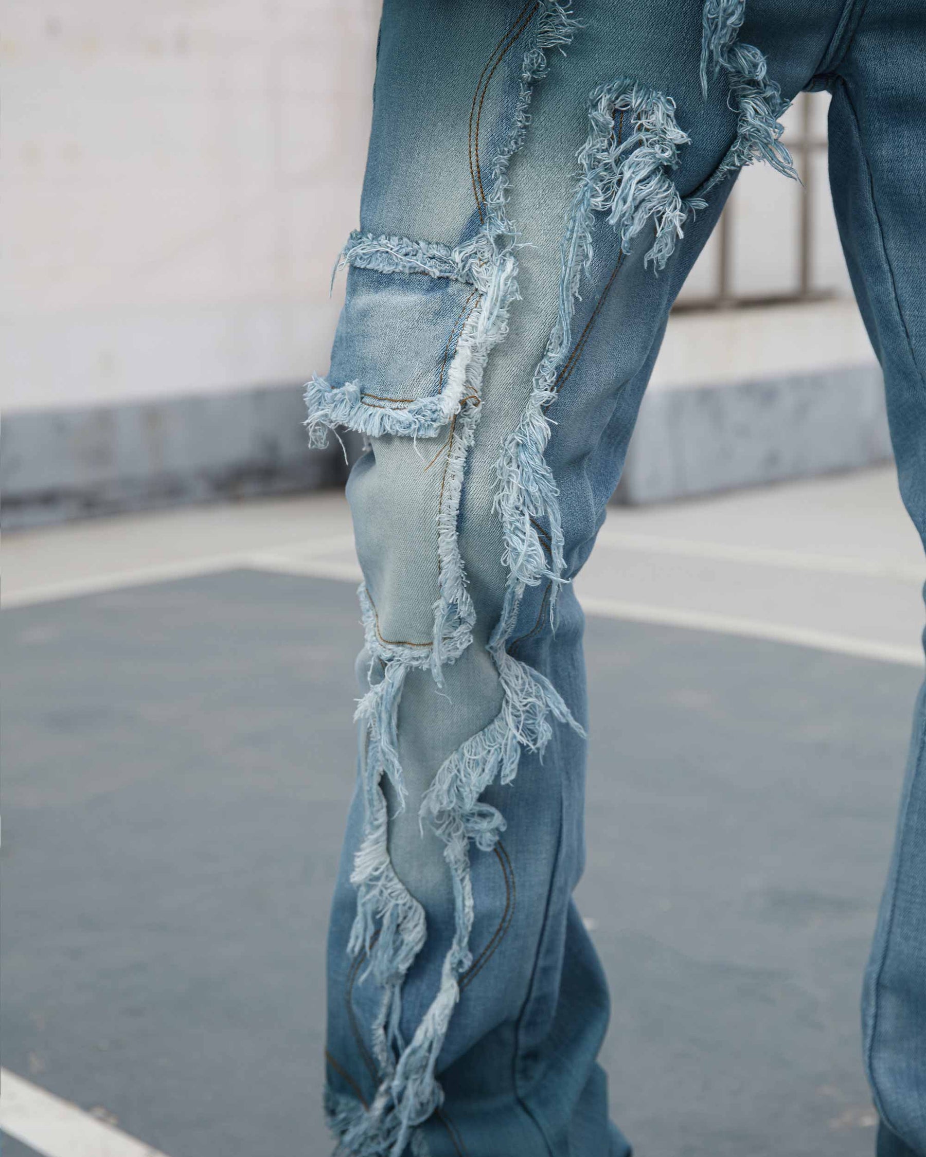 Irregular Blue Flared Jeans with Fringe