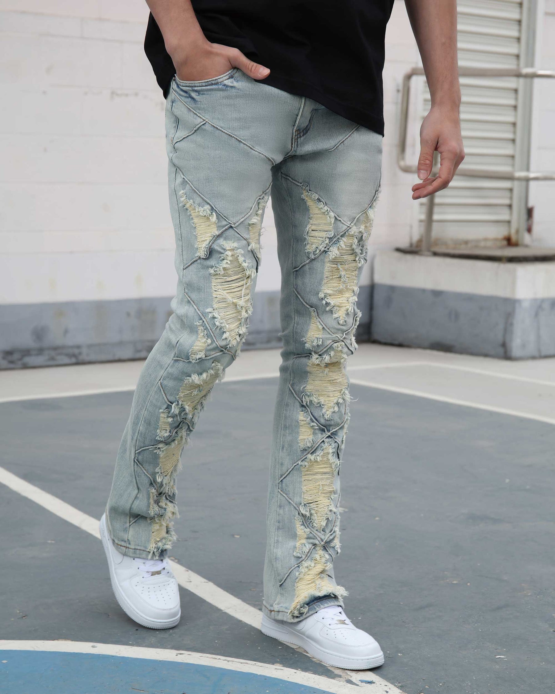Flared Blue Jeans with Distressed and Large Ripped Detail