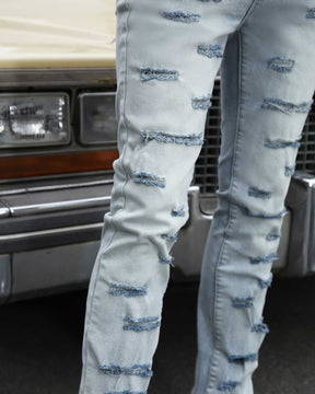 Light Wash Blue Flared Jeans with Cut-to-Shape Ripped