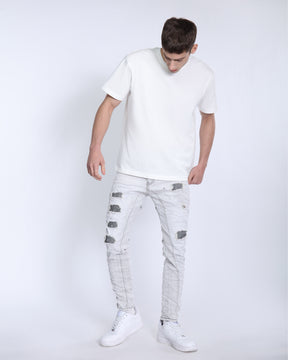 Slim Fit Gray Jeans with Rips, Patches, and Distressed Detailing