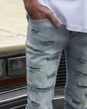 Light Wash Blue Flared Jeans with Cut-to-Shape Ripped