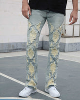 Flared Blue Jeans with Distressed and Large Ripped Detail