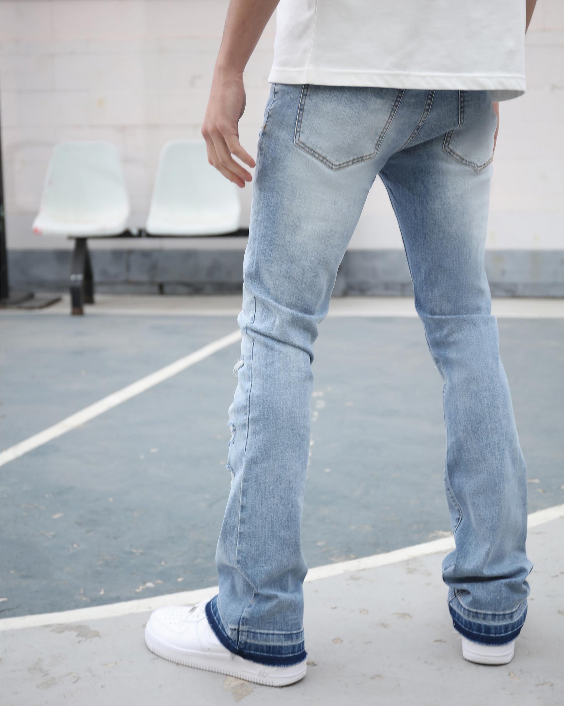 Light Wash Blue Ripped Jeans with Irregular Ripped