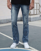 Light Wash Blue Jeans with Ripped Text