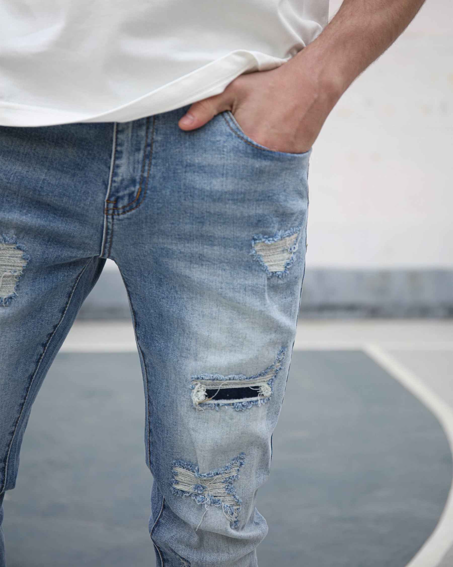 Light Wash Blue Ripped Jeans with Irregular Ripped