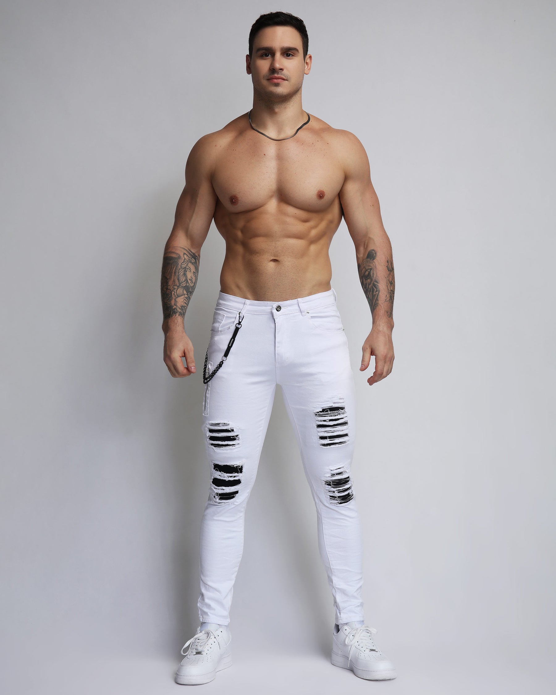 Large Ripped White Jeans with Black Patches