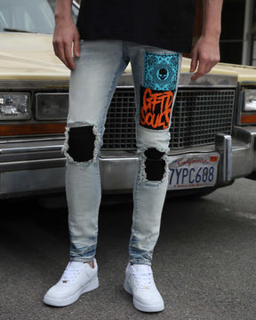 Light Wash Slim Fit Blue Jeans with Graffiti Patch
