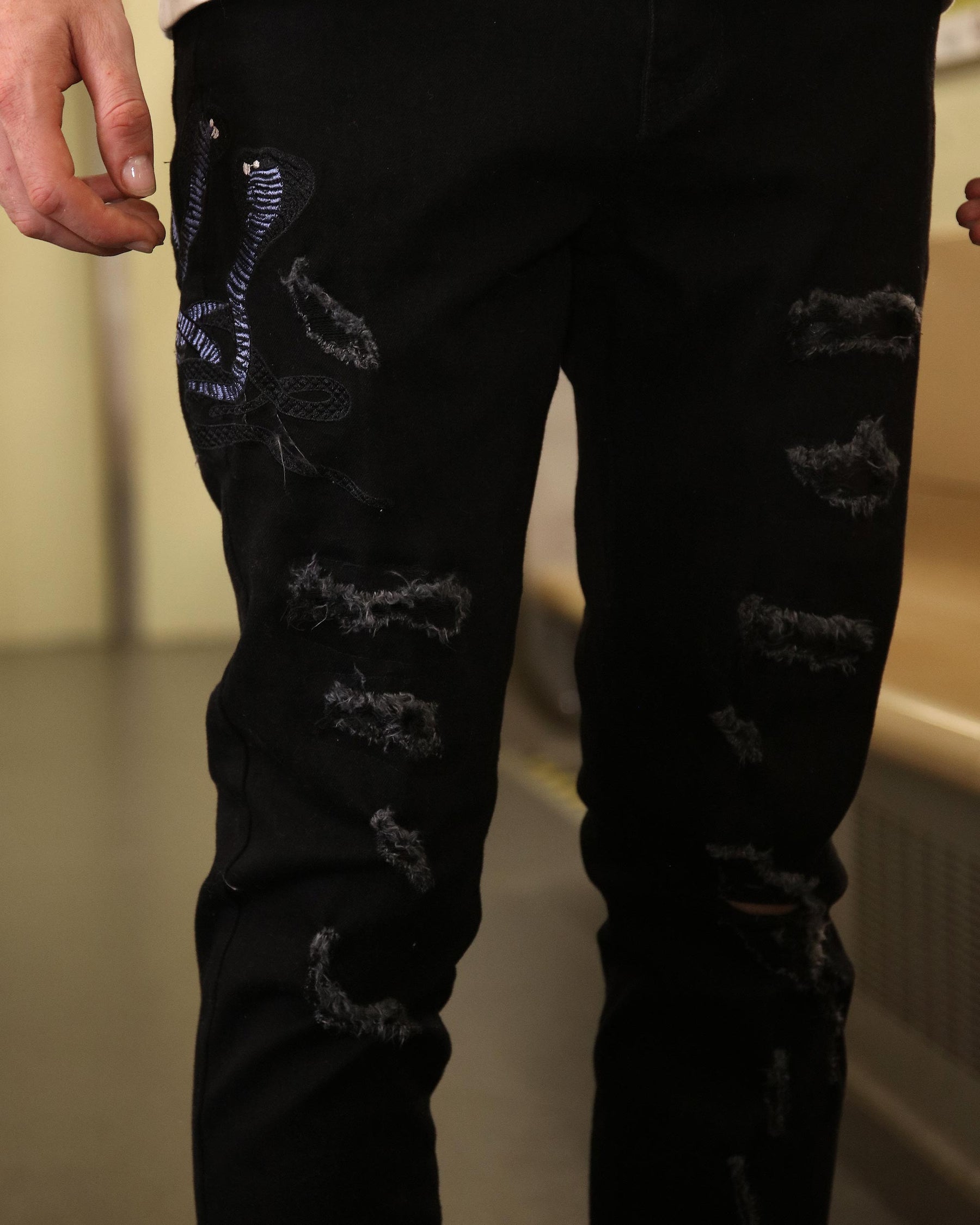 LOGEQI Stylish Black Ripped Jeans with Embroidered Flair