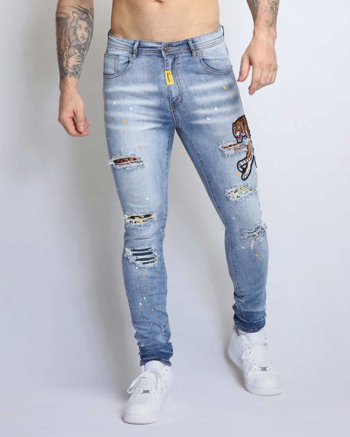 Wild Elegance Blue Ripped Jeans with Delicate Tiger Embroidery