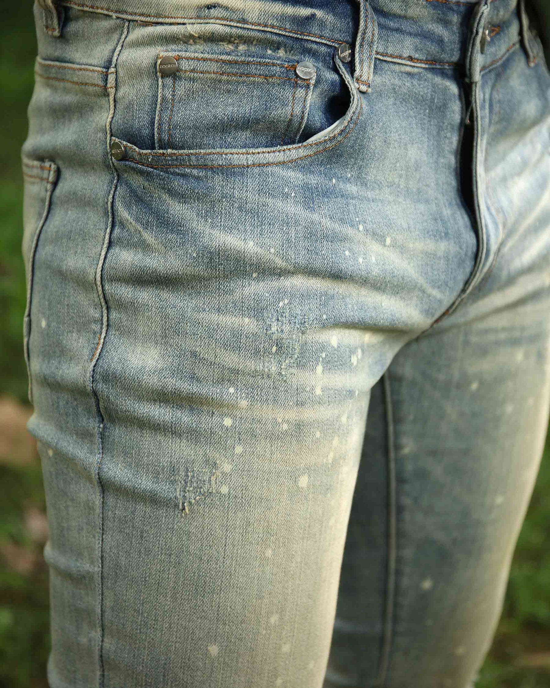 Distressed Blue Ripped Jeans with spray-painted