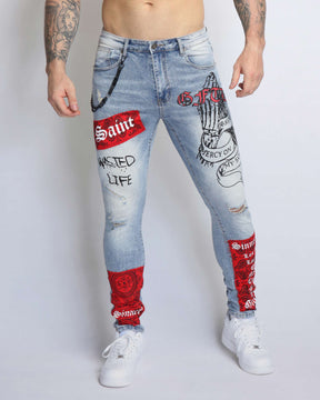 Graffiti Ripped Blue Jeans with Red Patches and Cashew Flower Elements