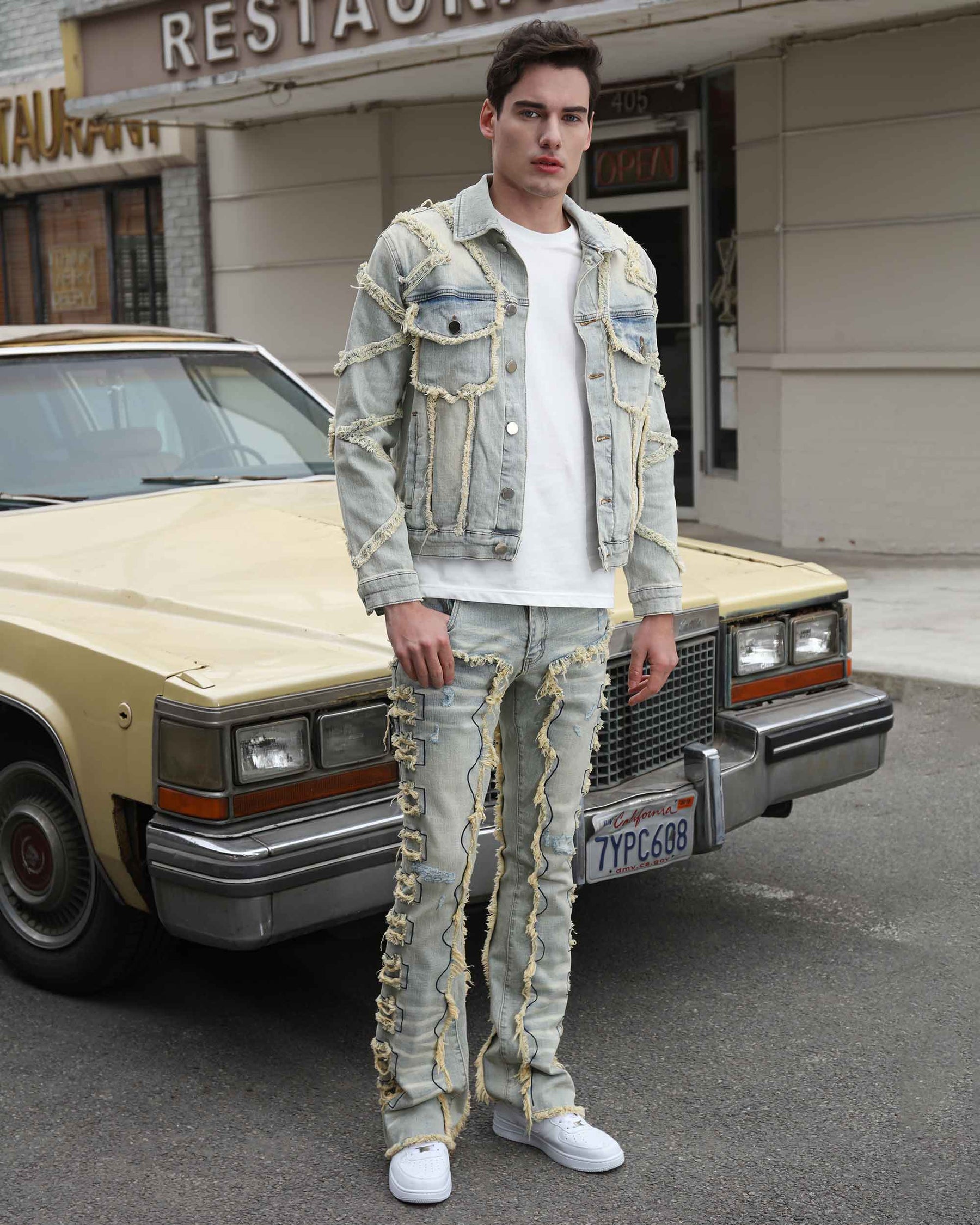 Vintage Blue Denim Jacket with Ripped Stitching