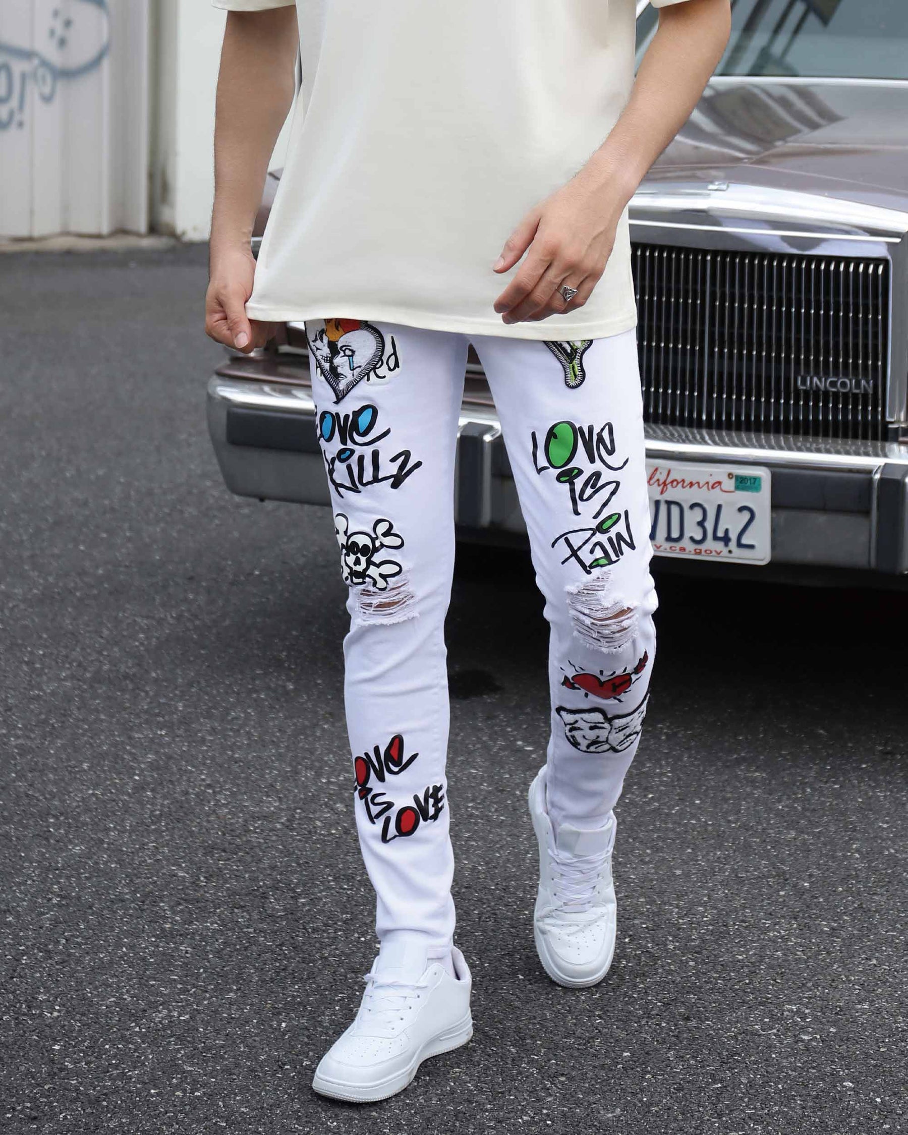 White Ripped Jeans with Colorful Graffiti