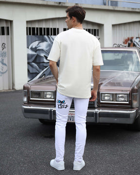 White Ripped Jeans with Colorful Graffiti