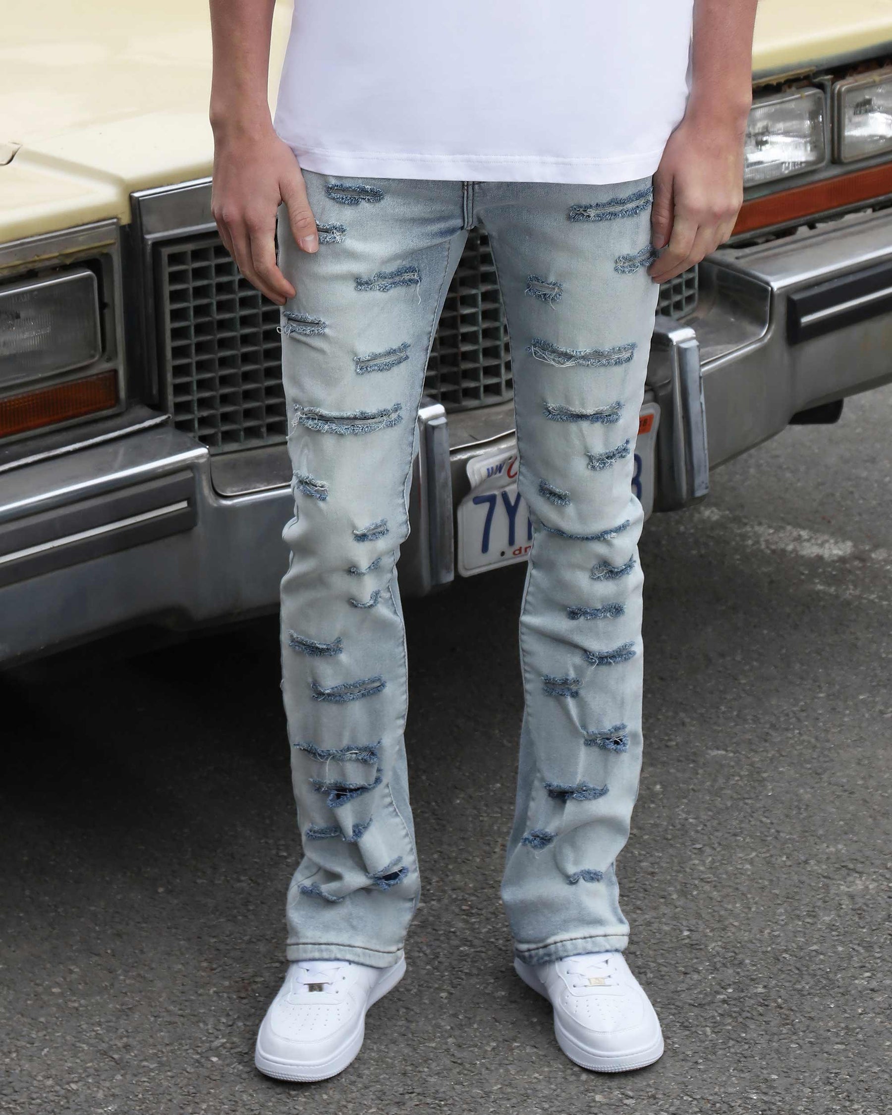 Light Wash Blue Flared Jeans with Cut-to-Shape Ripped