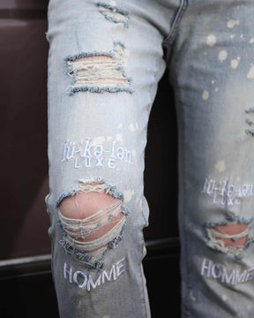 Logeqi Spray Painted Light Blue Ripped Jeans with Text Embroidery