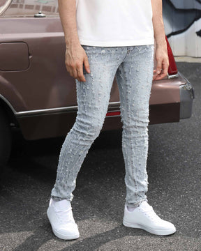 Logeqi Slim Fit Light Wash Blue Ripped Jeans with Small Rips