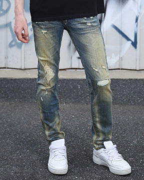 Irregularly Distressed Dark Wash Slim Fit Blue Ripped Jeans