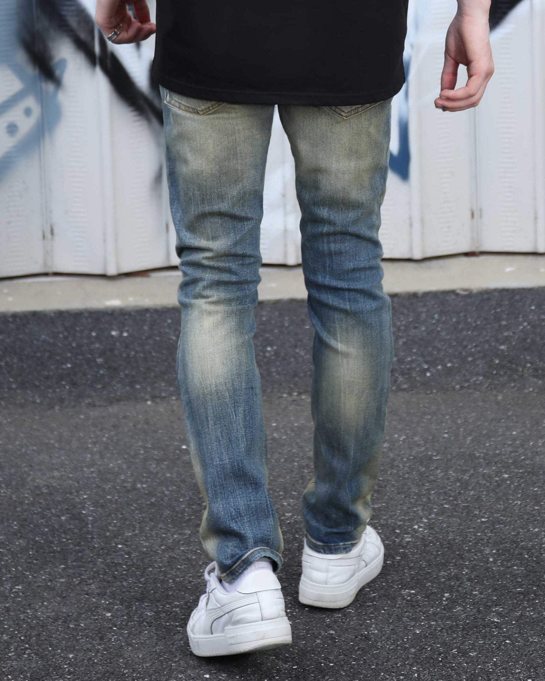 Irregularly Distressed Dark Wash Slim Fit Blue Ripped Jeans