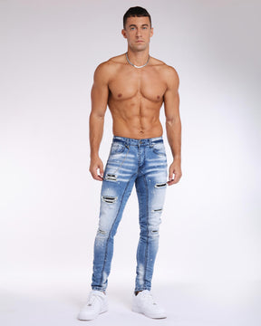 LOGEQI Spray Painted Ripped Blue Jeans in Light Wash